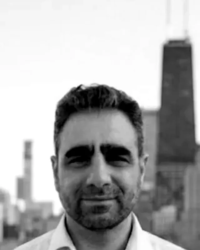 Gaston Sitbon on the Chicago lakefront, the skyline behind him